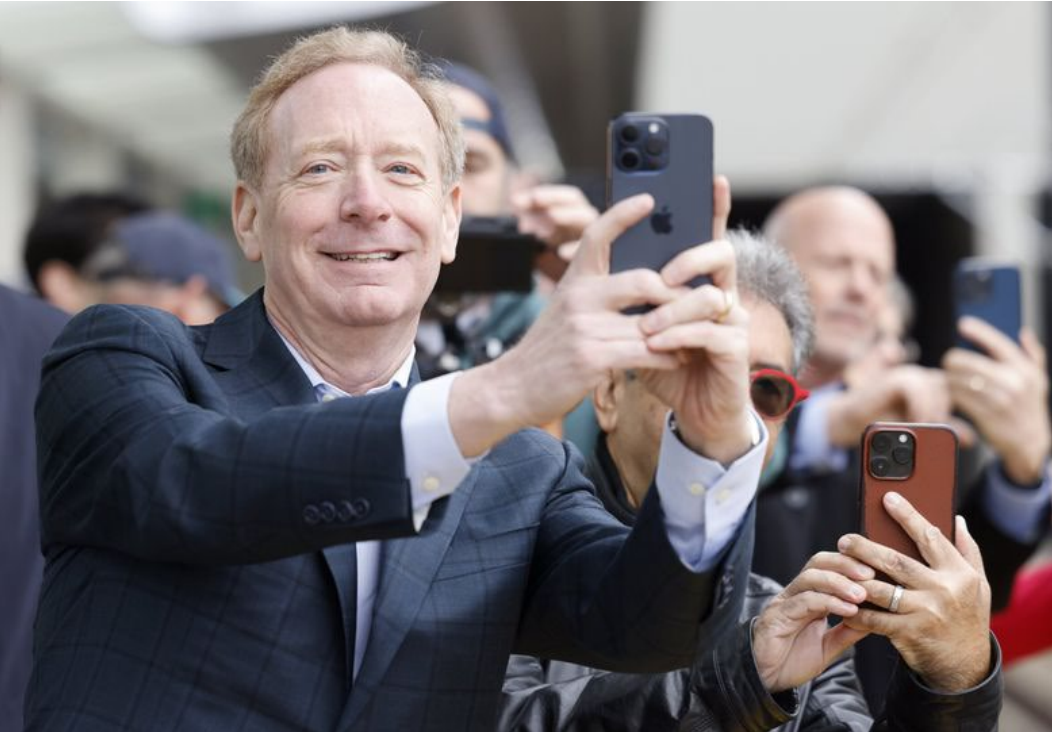 Man taking picture with iPhone